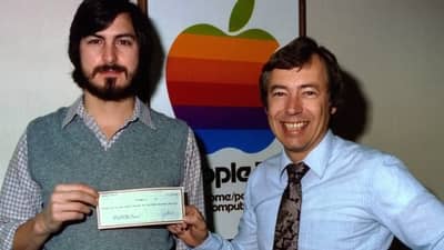 1977 - Steve Jobs and Mike Markkula with a cheque symbolising his investment in Apple